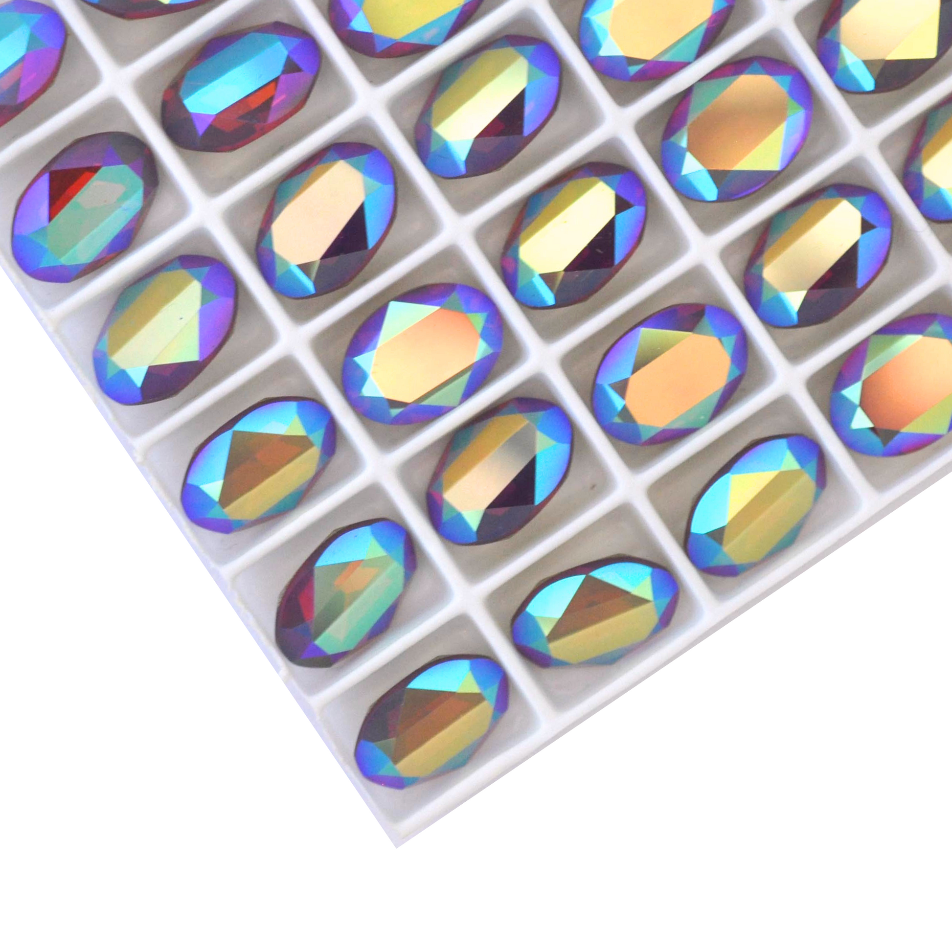 Oval shape faceted Austrian crystal rhinestones in the color Cyclamen Opal AB displayed on a white background.