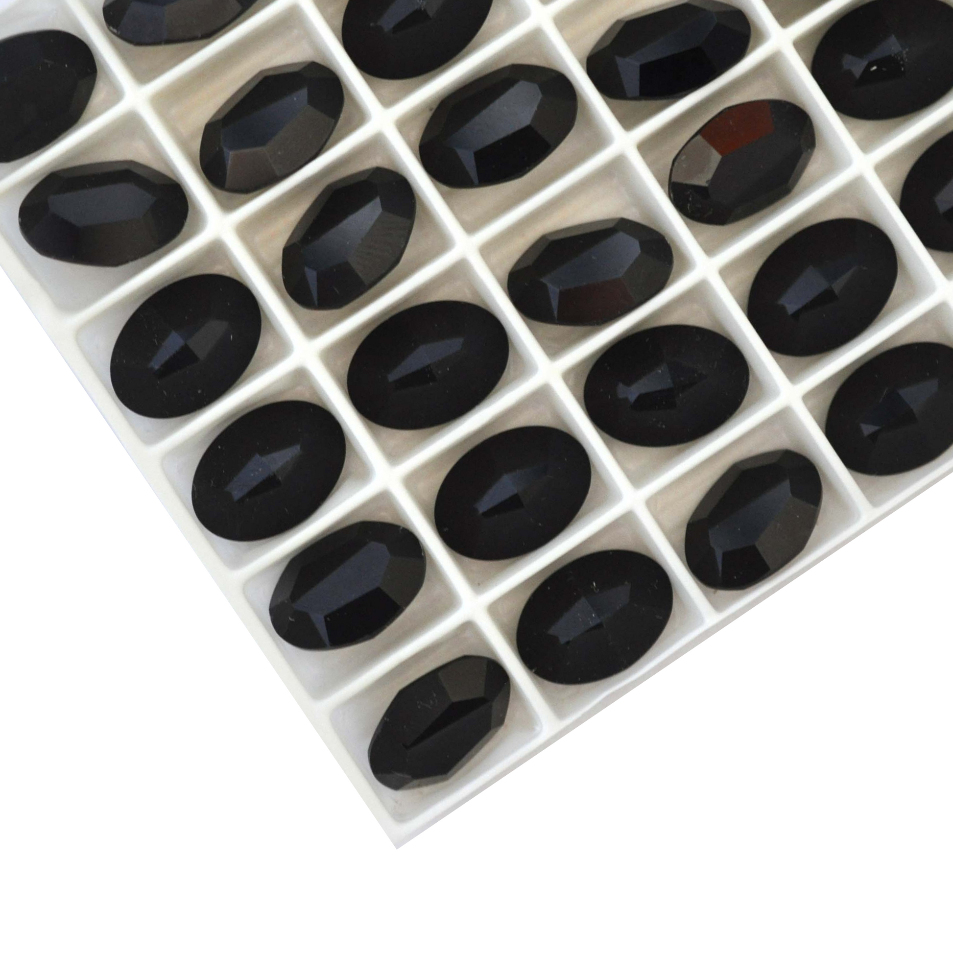 Oval shape faceted Austrian crystal rhinestones in the color Jet displayed on a white background.