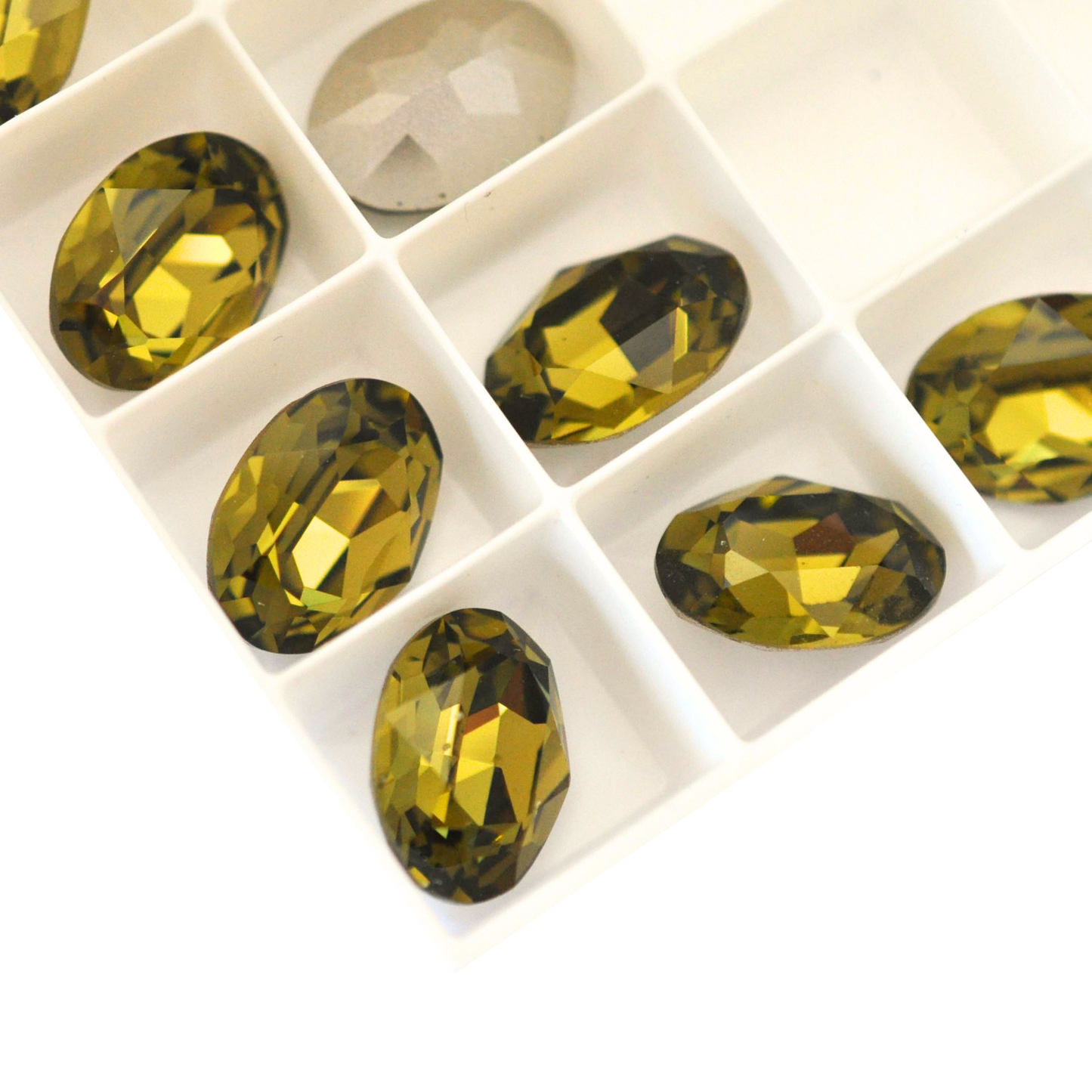Oval shape faceted Austrian crystal rhinestones in the color Khaki displayed on a white background.