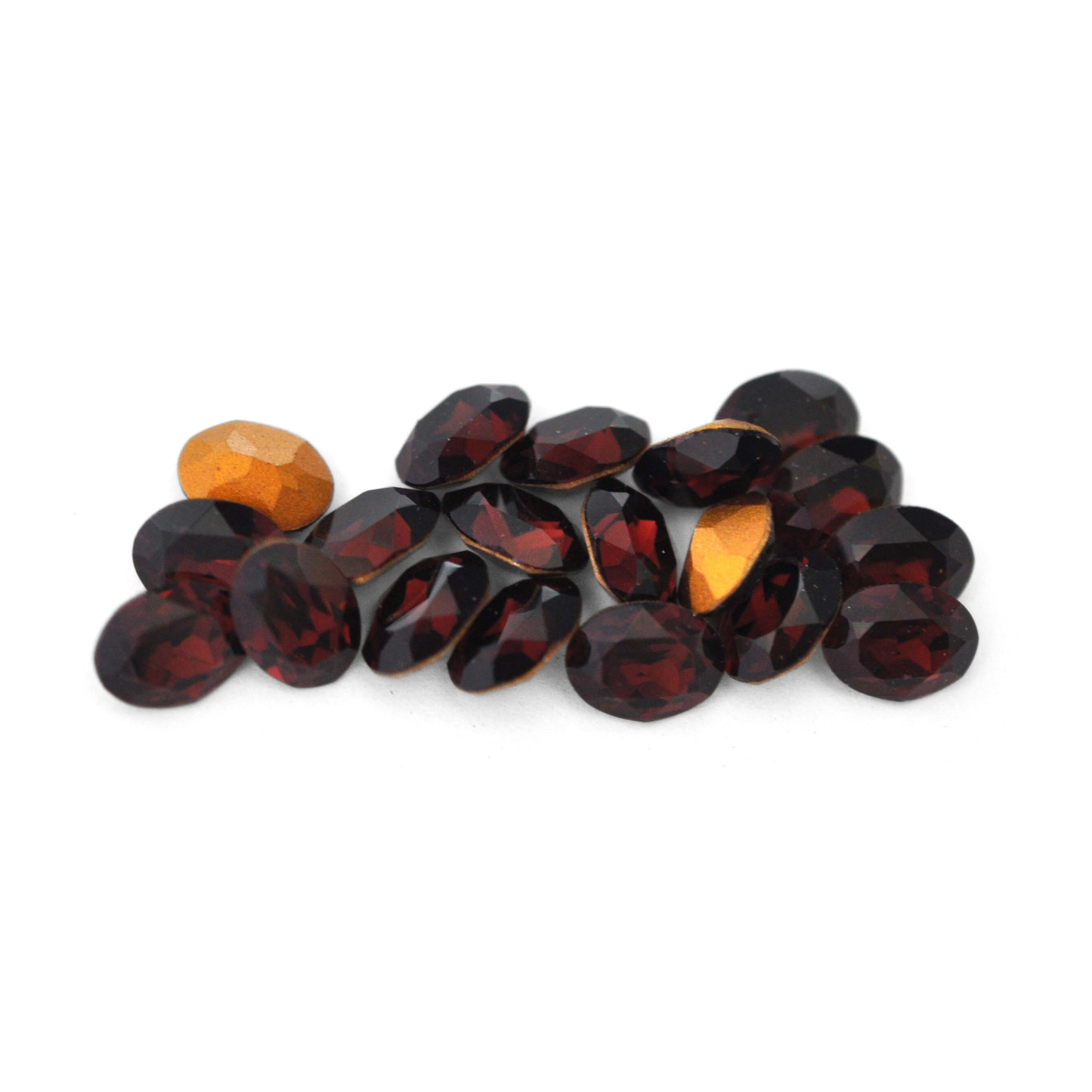 Oval shaped faceted Austrian crystal rhinestones in the color Burgundy displayed on a white background.