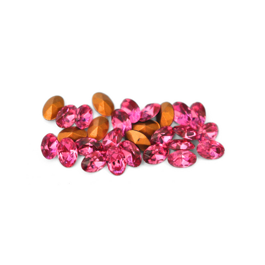 Oval shaped faceted Austrian crystal rhinestones in the color Rose displayed on a white background.