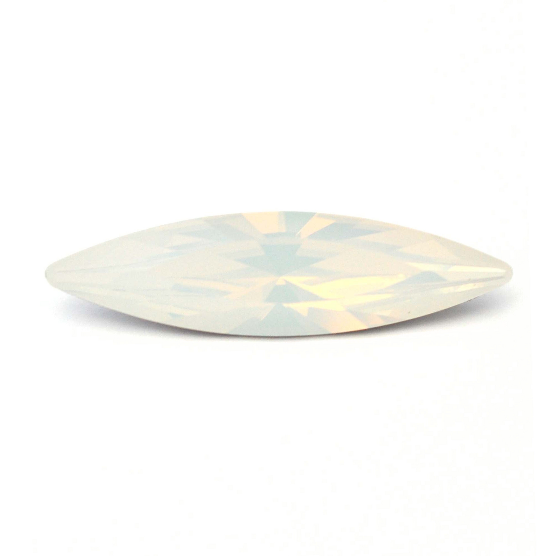 One large navette shape faceted Austrian crystal rhinestones in the color White Opal displayed on a white background.