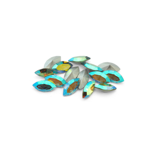 Navette shaped faceted Austrian crystal rhinestones in the color Peridot AB displayed on a white background.