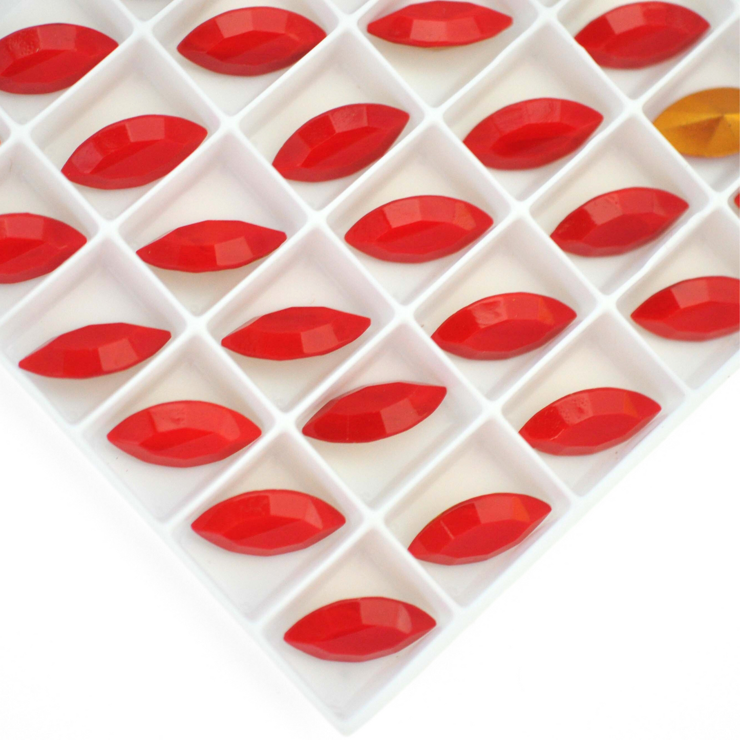 Navette shaped faceted Austrian crystal rhinestones in the color Cherry Red displayed on a white background.