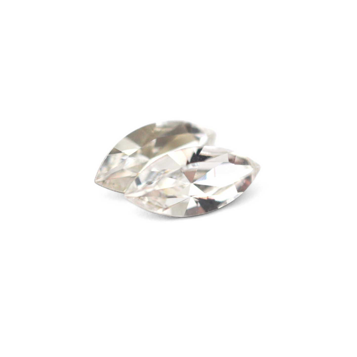 Navette shaped faceted Austrian crystal rhinestones in the color Crystal Clear displayed on a white background.