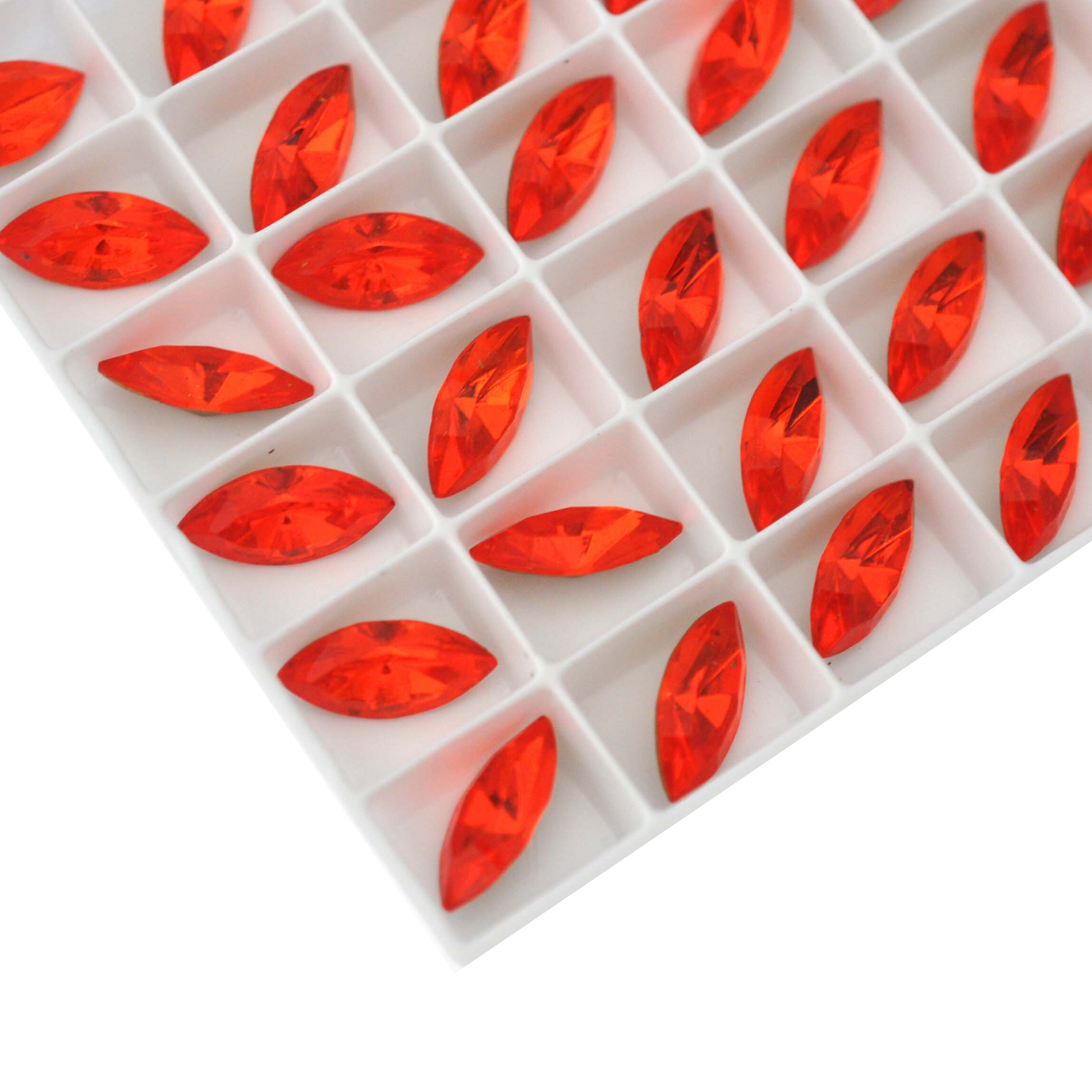 Navette shaped faceted Austrian crystal rhinestones in the color Hyacinth displayed in a tray on a white background.