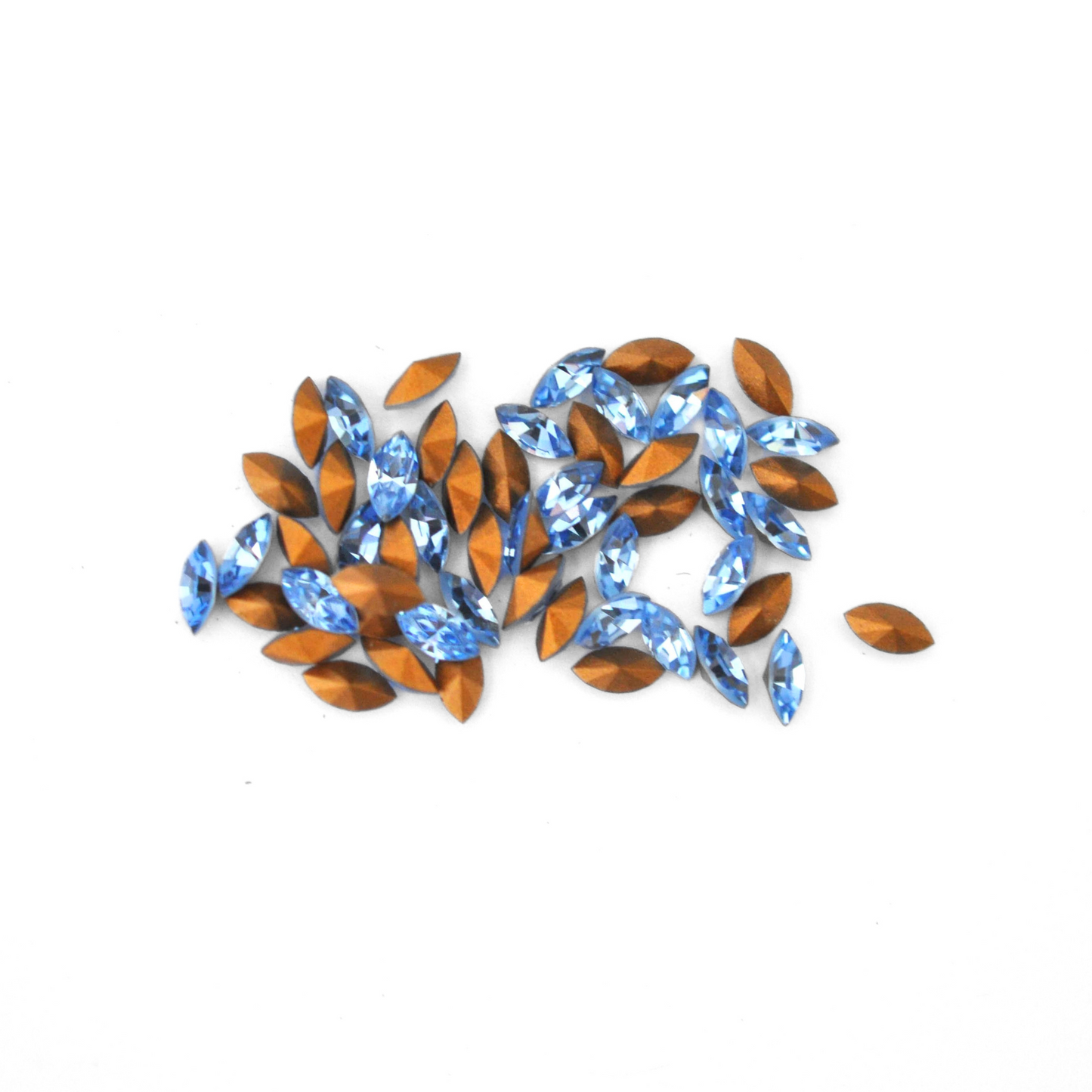 Navette shaped faceted Austrian crystal rhinestones in the color Light Sapphire displayed on a white background.