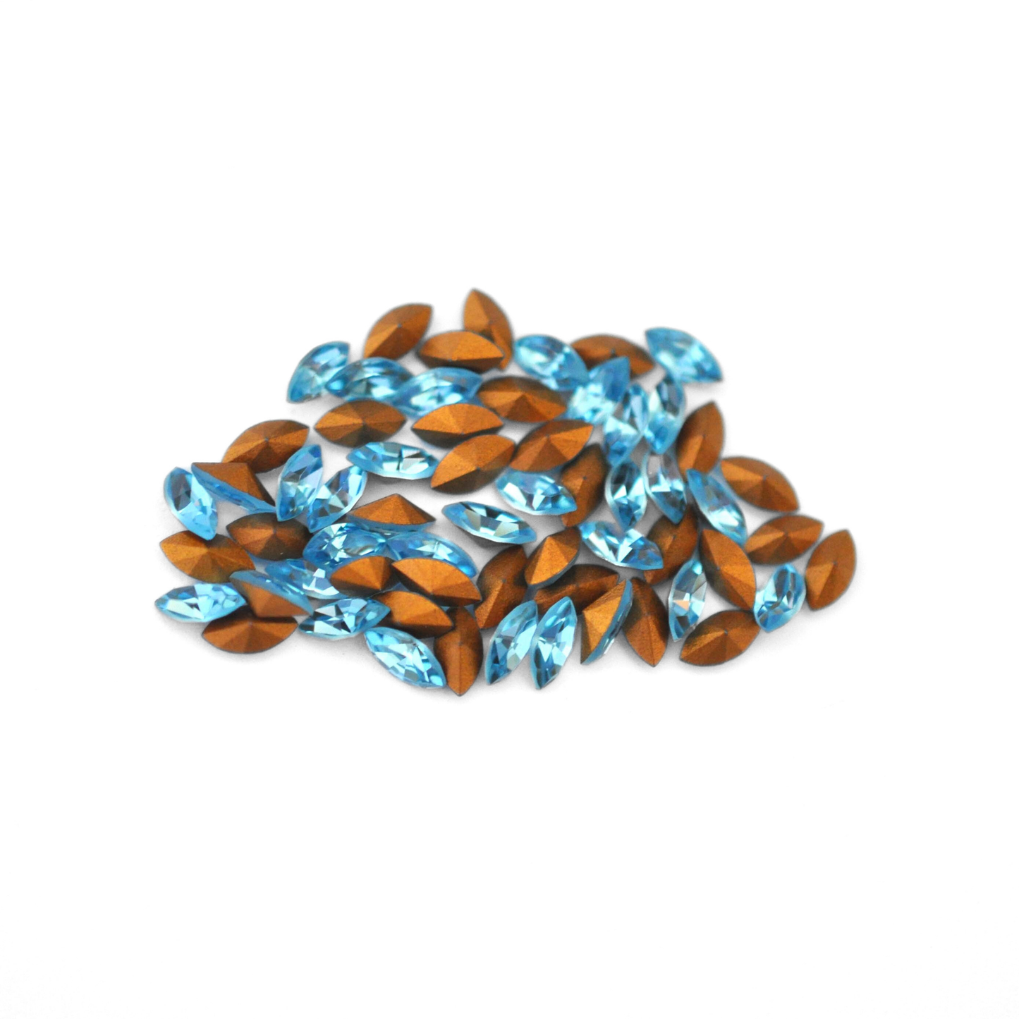 Navette shaped faceted Austrian crystal rhinestones in the color Aquamarine displayed on a white background.
