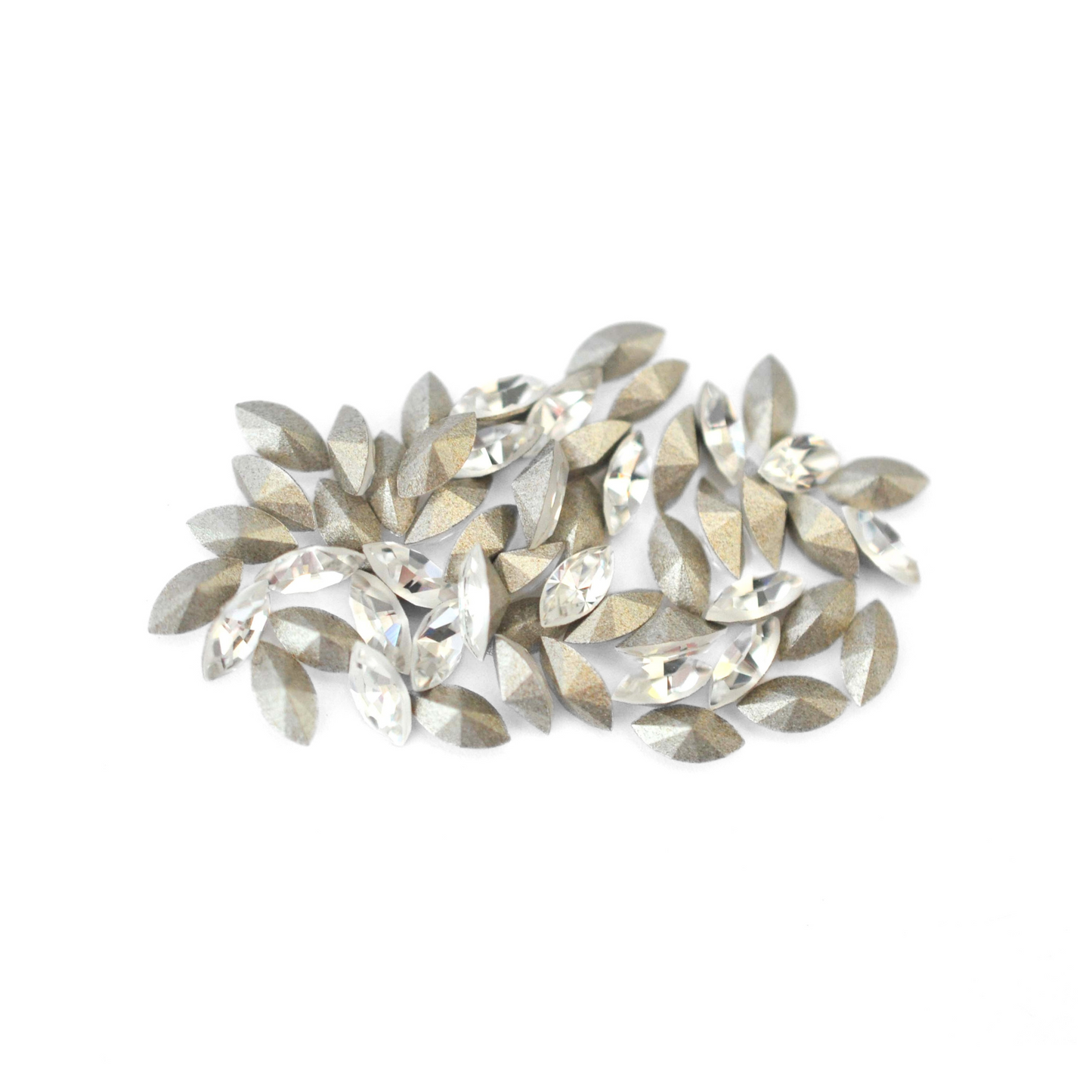 Navette shaped faceted Austrian crystal rhinestones in the color Crystal displayed on a white background.