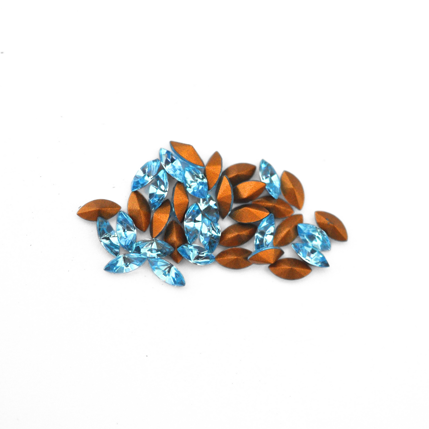 Navette shaped faceted Austrian crystal rhinestones in the color Aquamarine displayed on a white background.