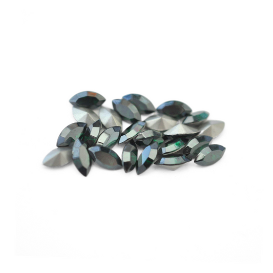 Navette shaped faceted Austrian crystal rhinestones in the color Emerald Satin displayed on a white background.
