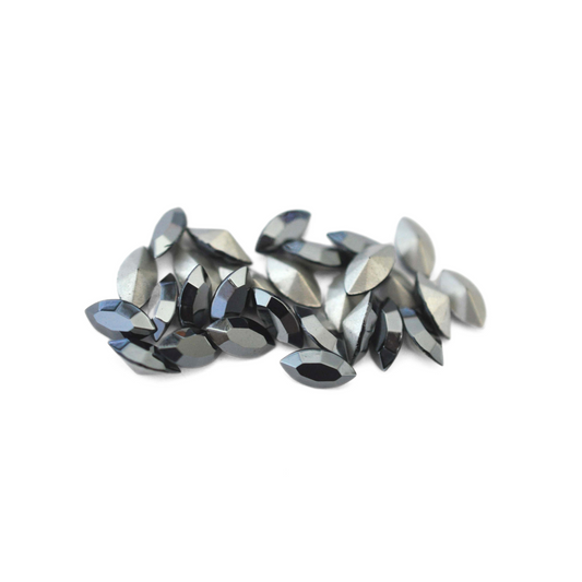 Navette shaped faceted Austrian crystal rhinestones in the color Jet Hematite displayed on a white background.