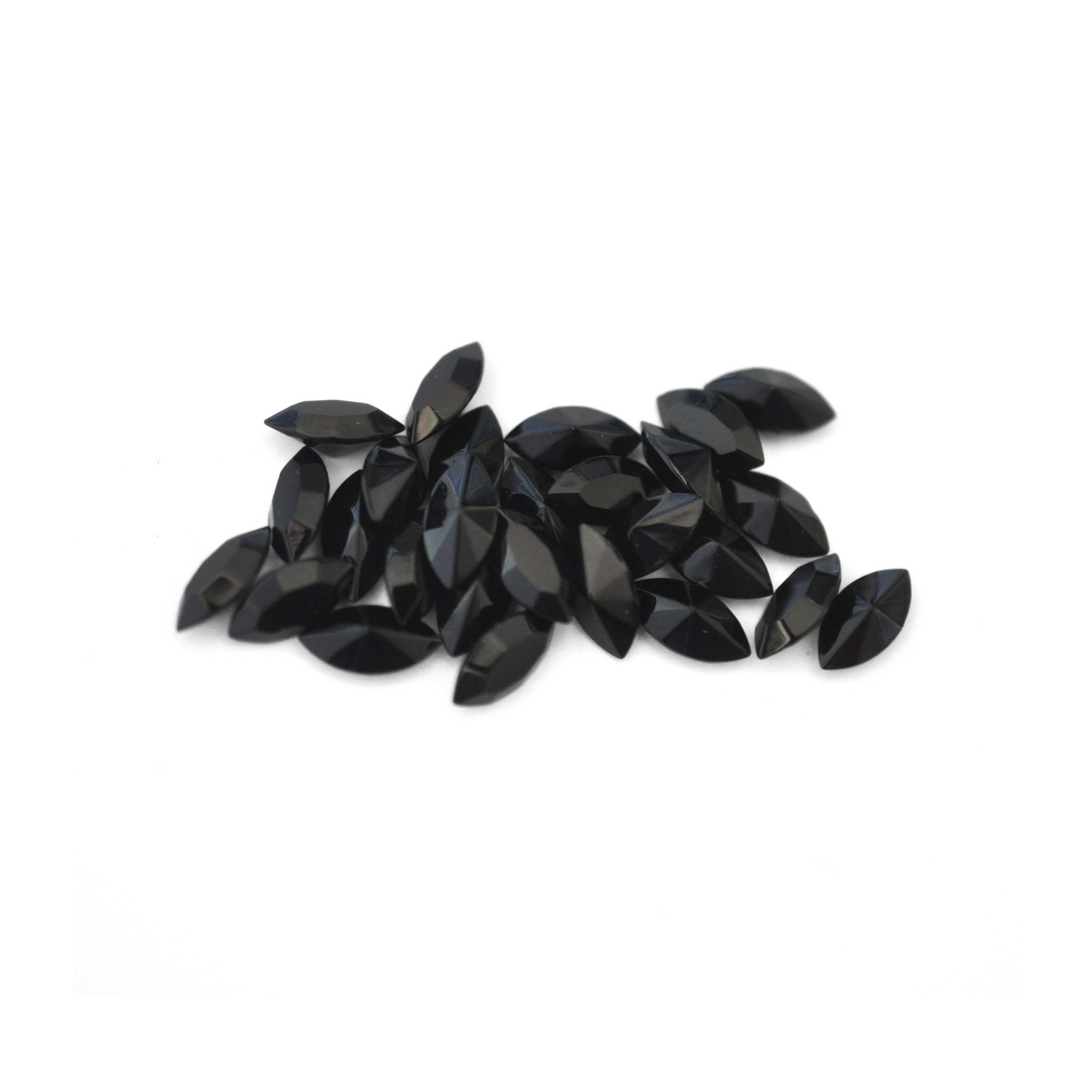Navette shaped faceted Austrian crystal rhinestones in the color Jet displayed on a white background.