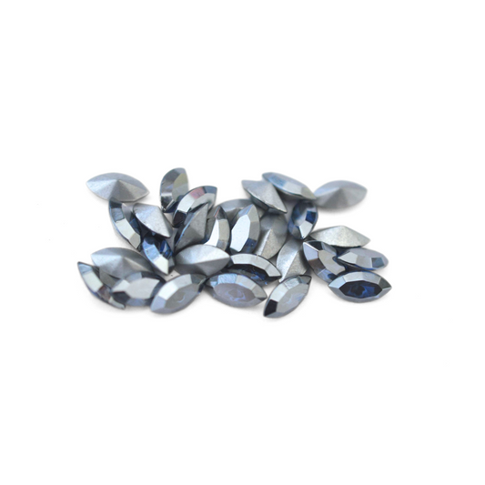 Navette shaped faceted Austrian crystal rhinestones in the color Sapphire Satin displayed on a white background.