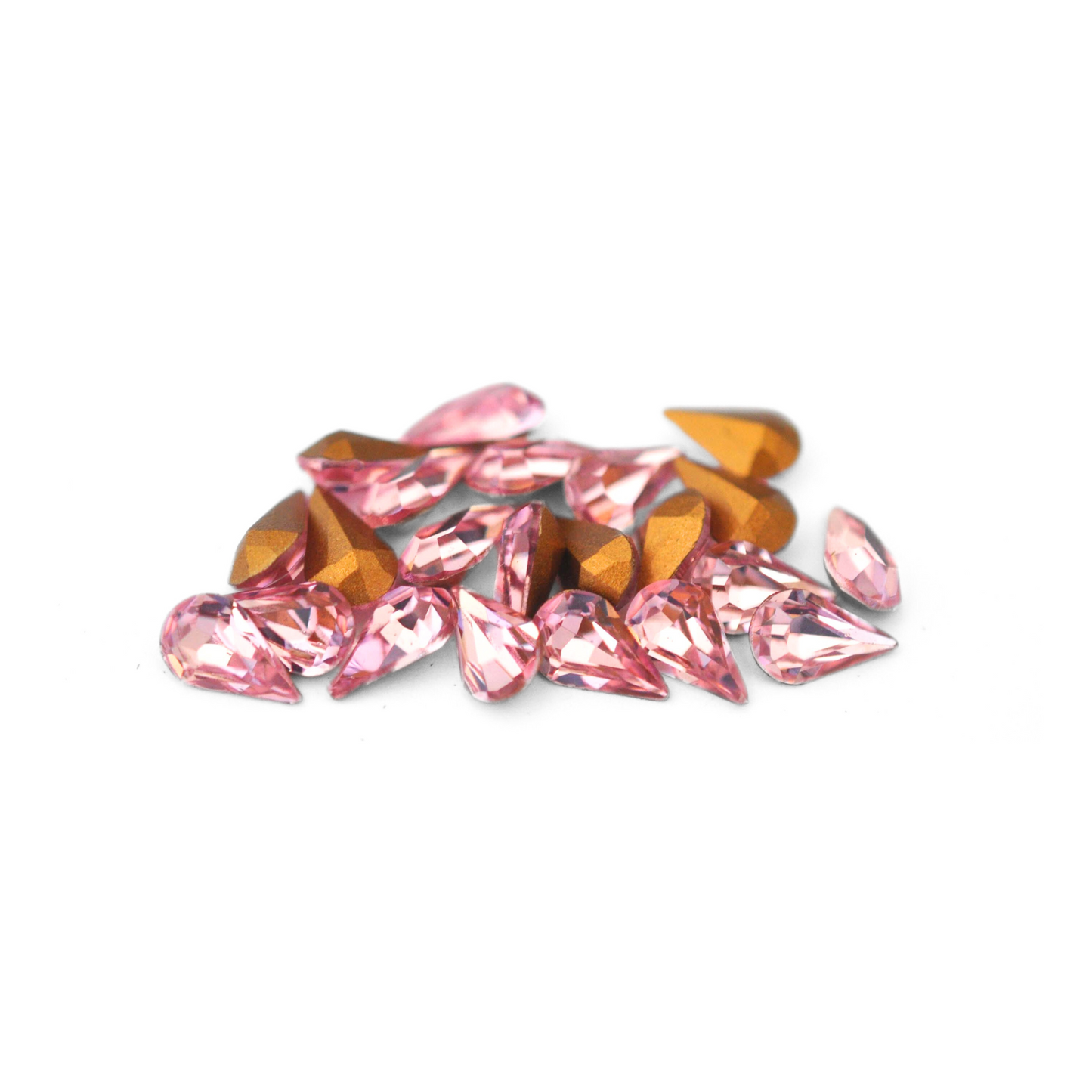 Pear shaped faceted Austrian crystal rhinestones in the color Light Rose displayed on a white background.