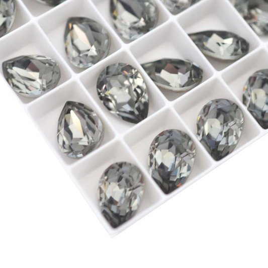 Pear shape faceted Austrian crystal rhinestones in the color Black Diamond displayed on a white background.