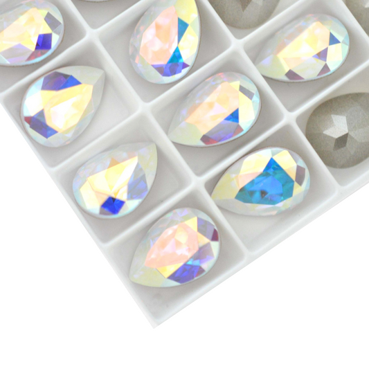 Pear shape faceted Austrian crystal rhinestones in the color Crystal AB displayed on a white background.