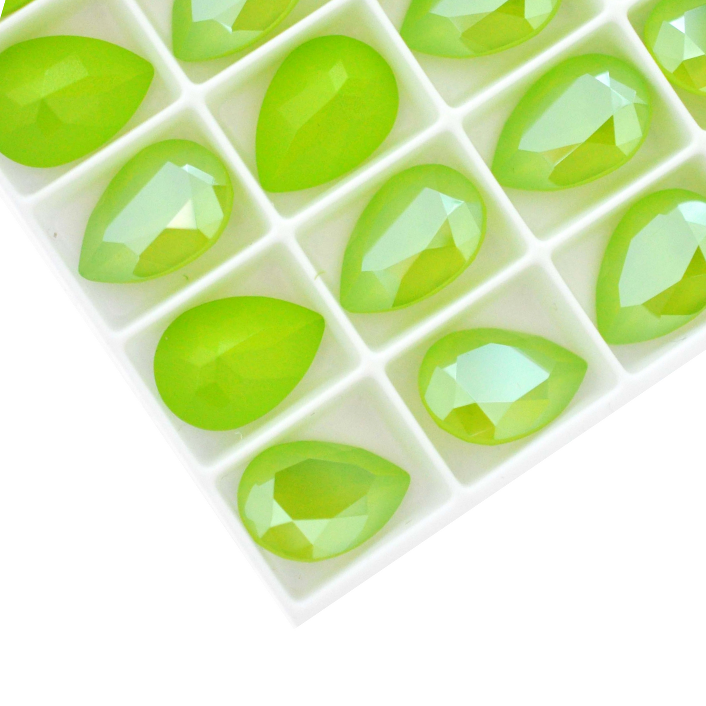 Pear shape faceted Austrian crystal rhinestones in the color Lime Lacquer displayed on a white background.
