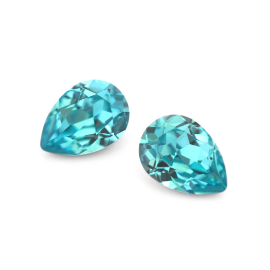 Pear shape faceted Austrian crystal rhinestones in the color Light Turquoise displayed on a white background.
