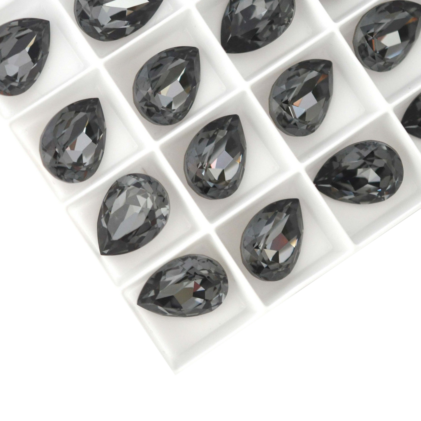 Pear shape faceted Austrian crystal rhinestones in the color Black Diamond displayed on a white background.