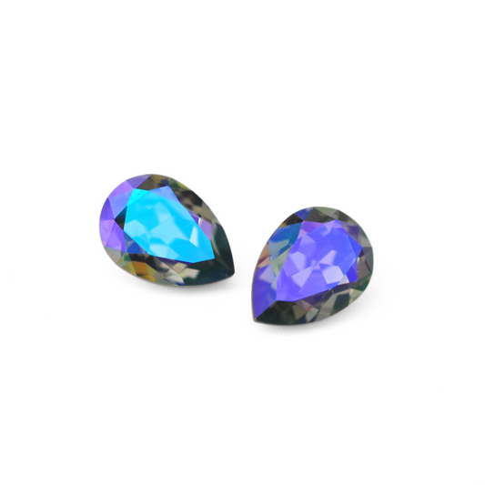 Pear shape faceted Austrian crystal rhinestones in the color Black Diamond Glacier Blue displayed on a white background.
