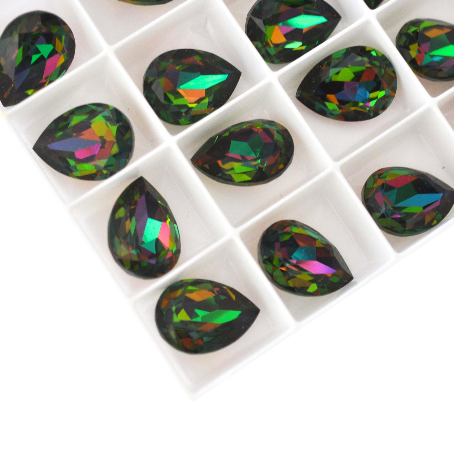 Pear shape faceted Austrian crystal rhinestones in the color Chrysolite Electra displayed on a white background.