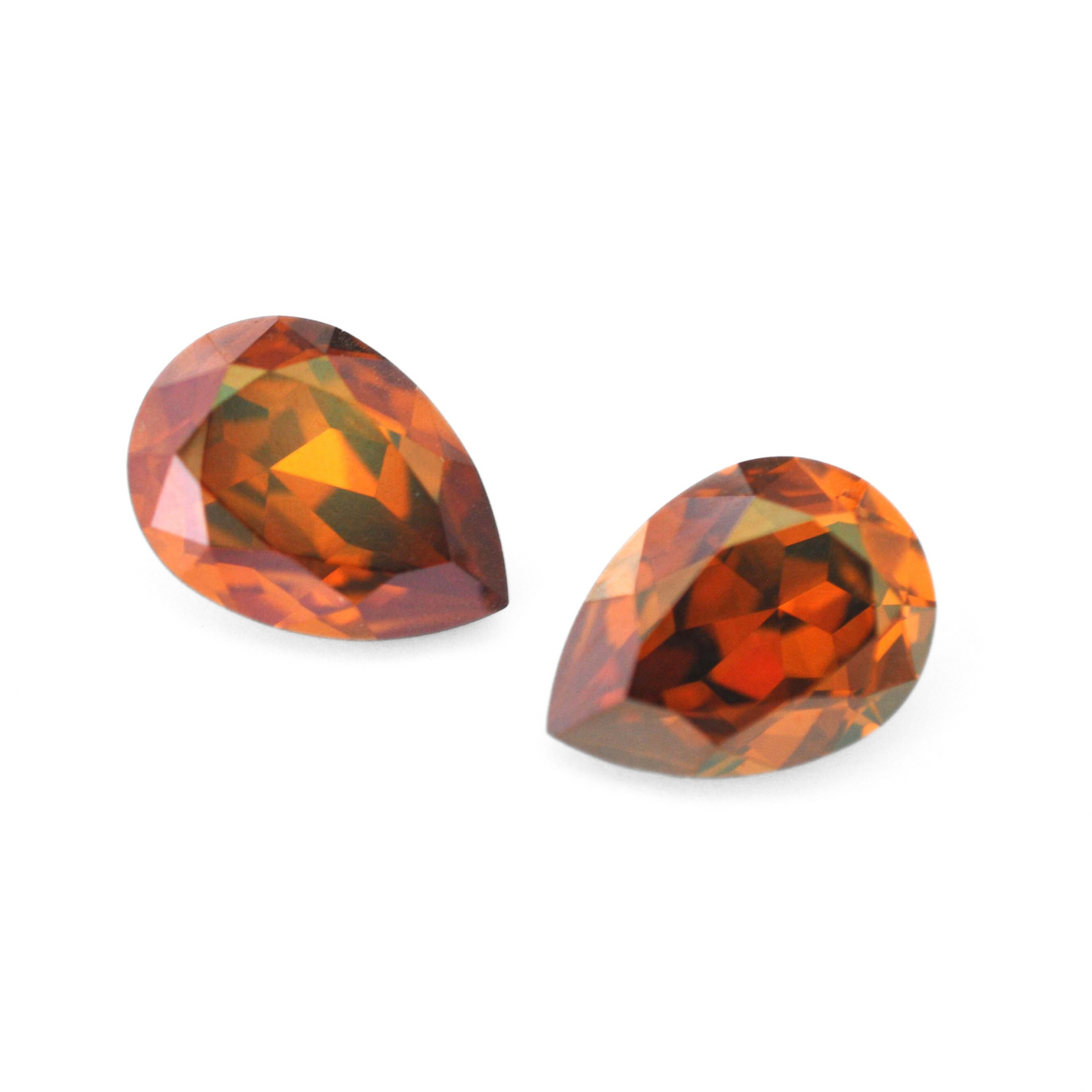 Pear shape faceted Austrian crystal rhinestones in the color Copper displayed on a white background.