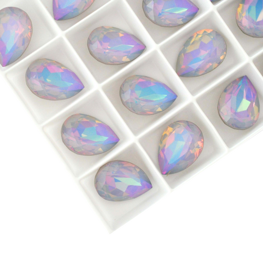 Pear shape faceted Austrian crystal rhinestones in the color Dreamy Vitrail displayed on a white background.