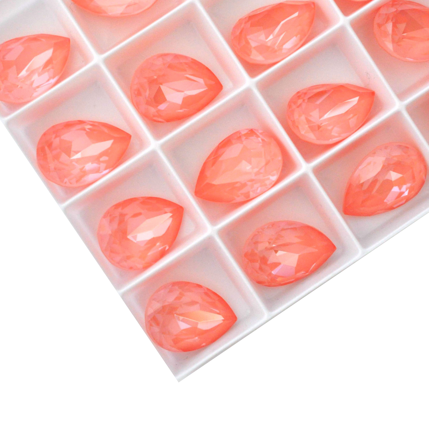 Pear shape faceted Austrian crystal rhinestones in the color Flamingo Ignite displayed on a white background.