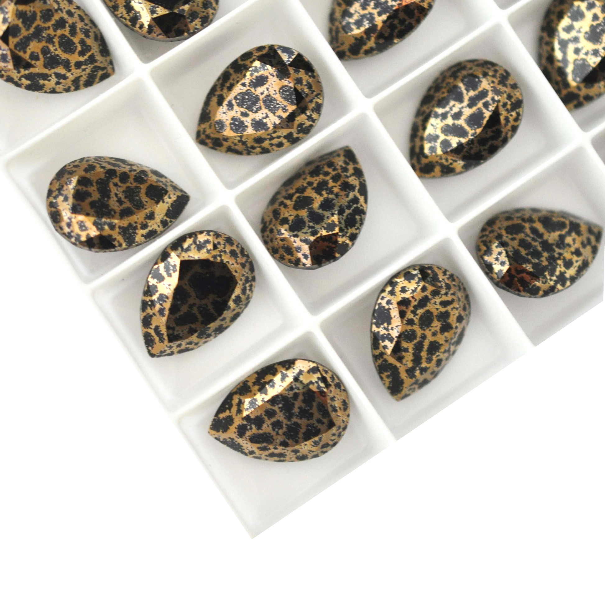 Pear shape faceted Austrian crystal rhinestones in the color Leopard displayed on a white background.