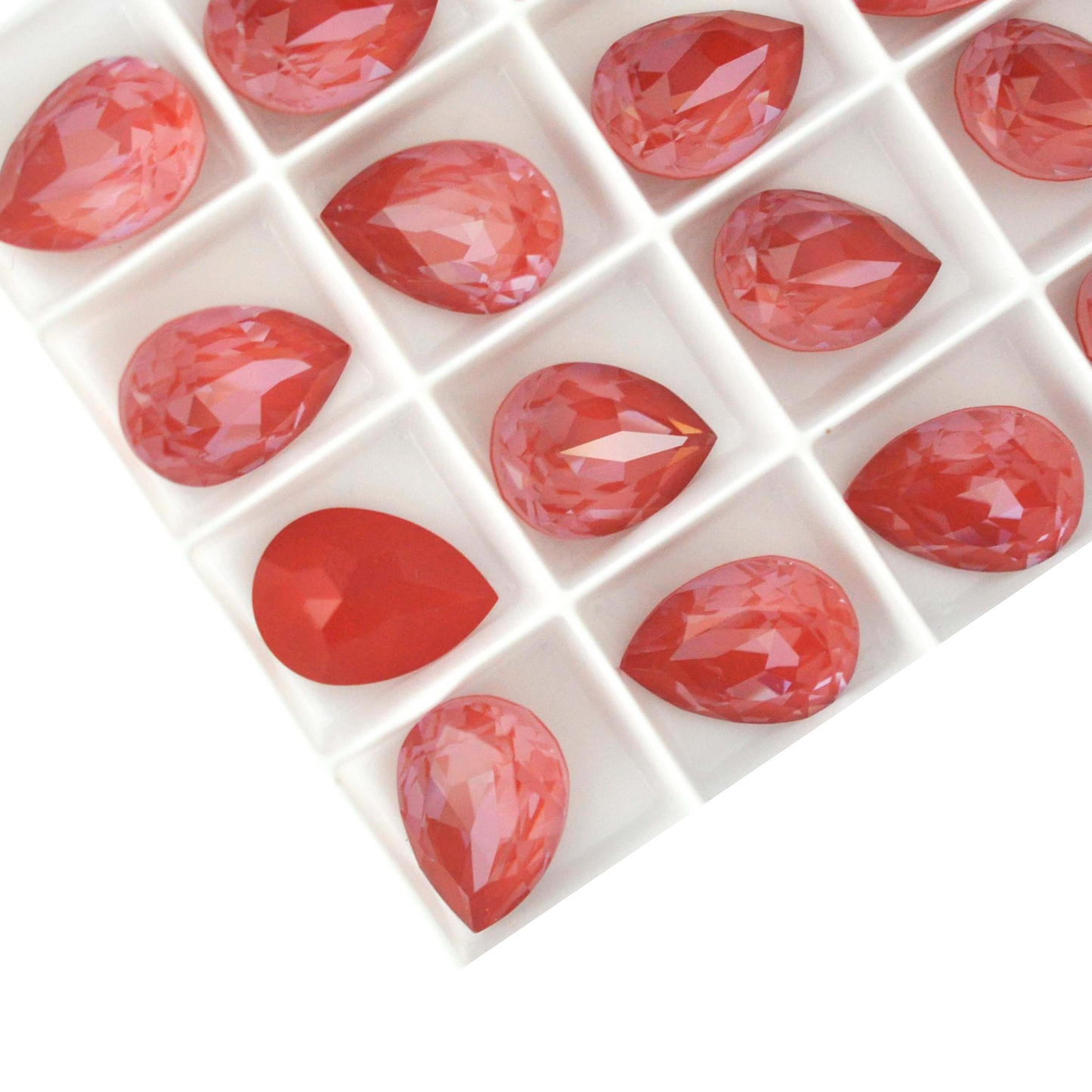 Pear shape faceted Austrian crystal rhinestones in the color Maroon Ignite displayed on a white background.