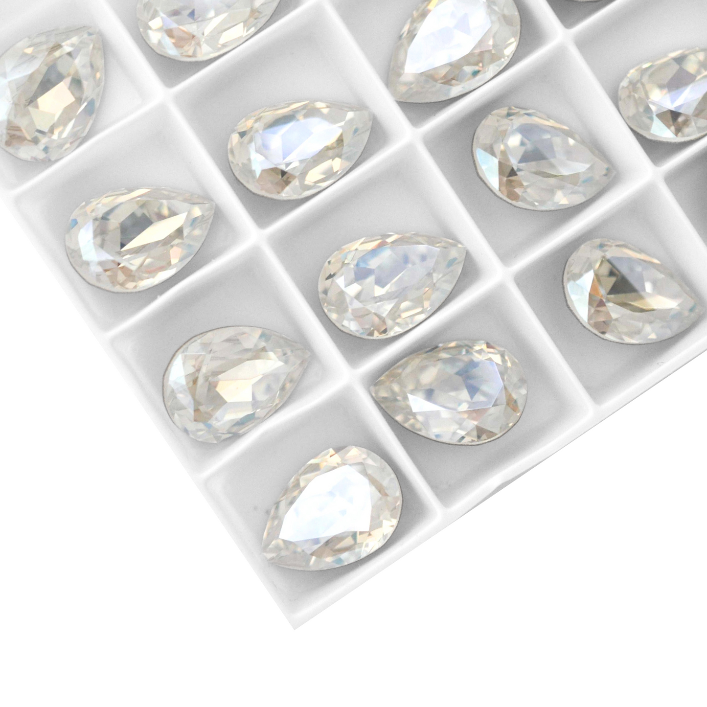 Pear shape faceted Austrian crystal rhinestones in the color Moonlight displayed on a white background.