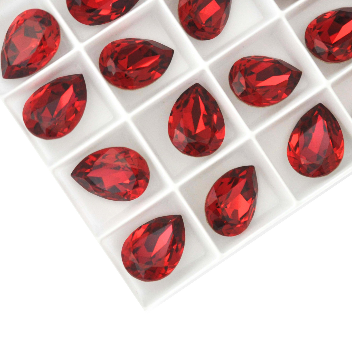 Pear shape faceted Austrian crystal rhinestones in the color Scarlet displayed on a white background.