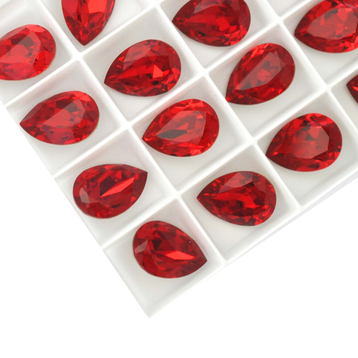 Pear shape faceted Austrian crystal rhinestones in the color Siam displayed on a white background.