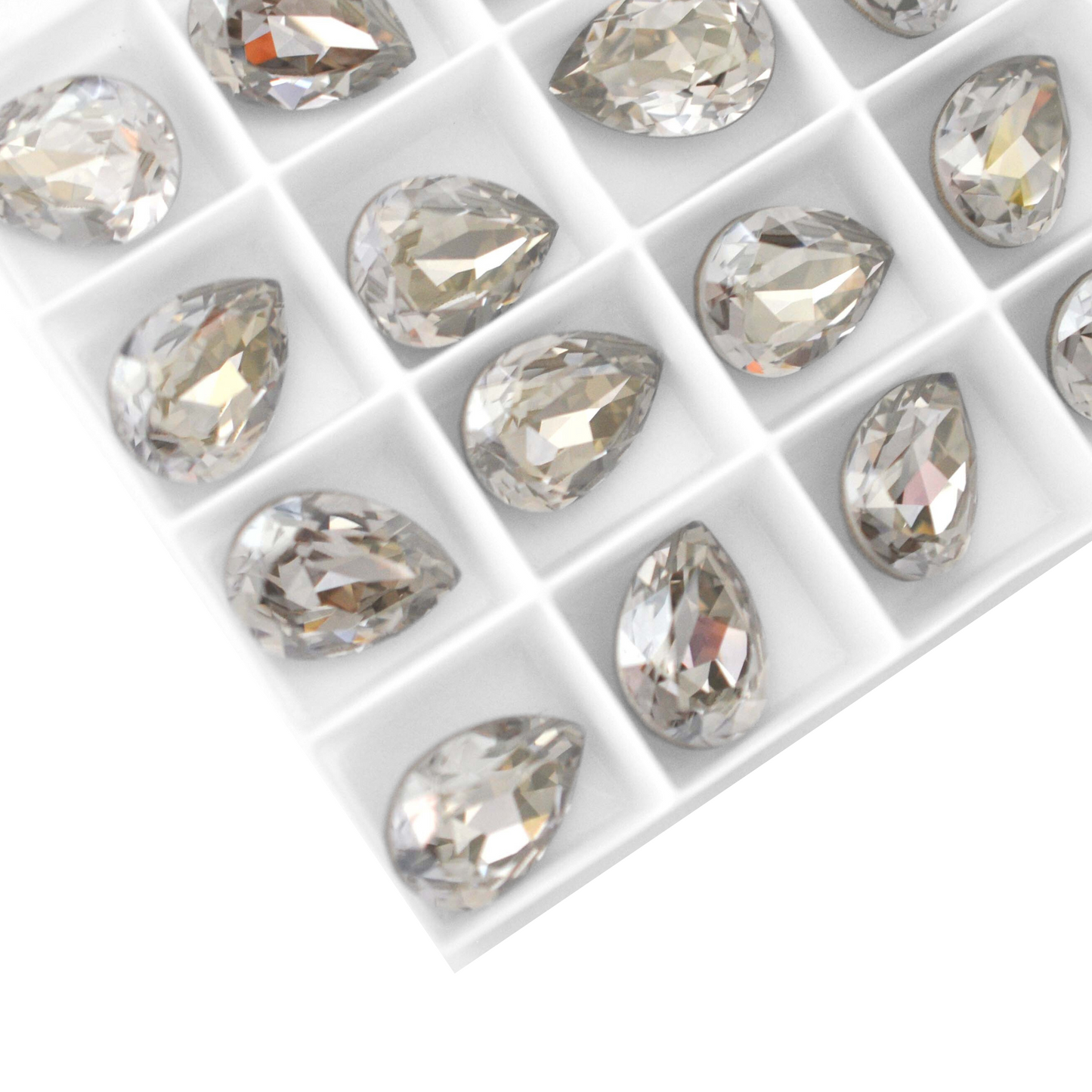 Pear shape faceted Austrian crystal rhinestones in the color Silver Shade displayed on a white background.