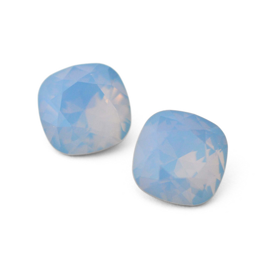 Cushion Square faceted Austrian crystal rhinestones in the color Air Blue Opal displayed on a white background.