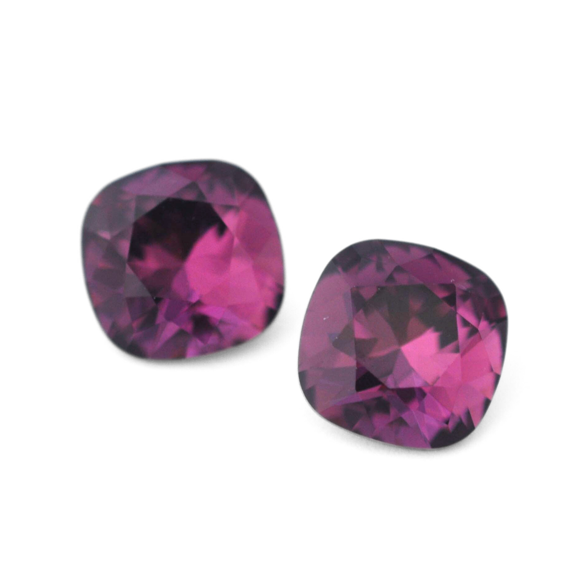 Cushion Square faceted Austrian crystal rhinestones in the color Amethyst displayed on a white background.