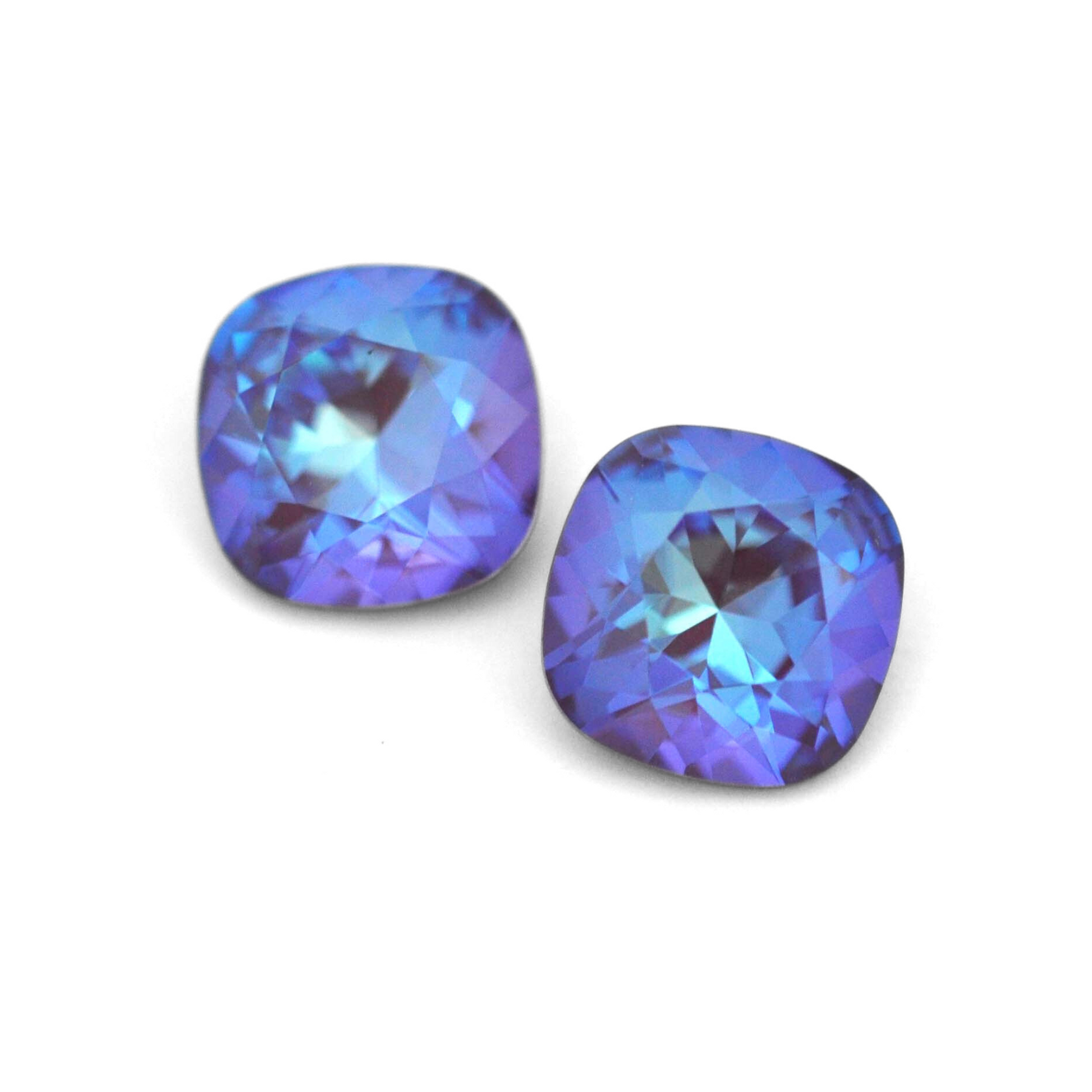 Cushion Square faceted Austrian crystal rhinestones in the color Burgundy Delite displayed on a white background.