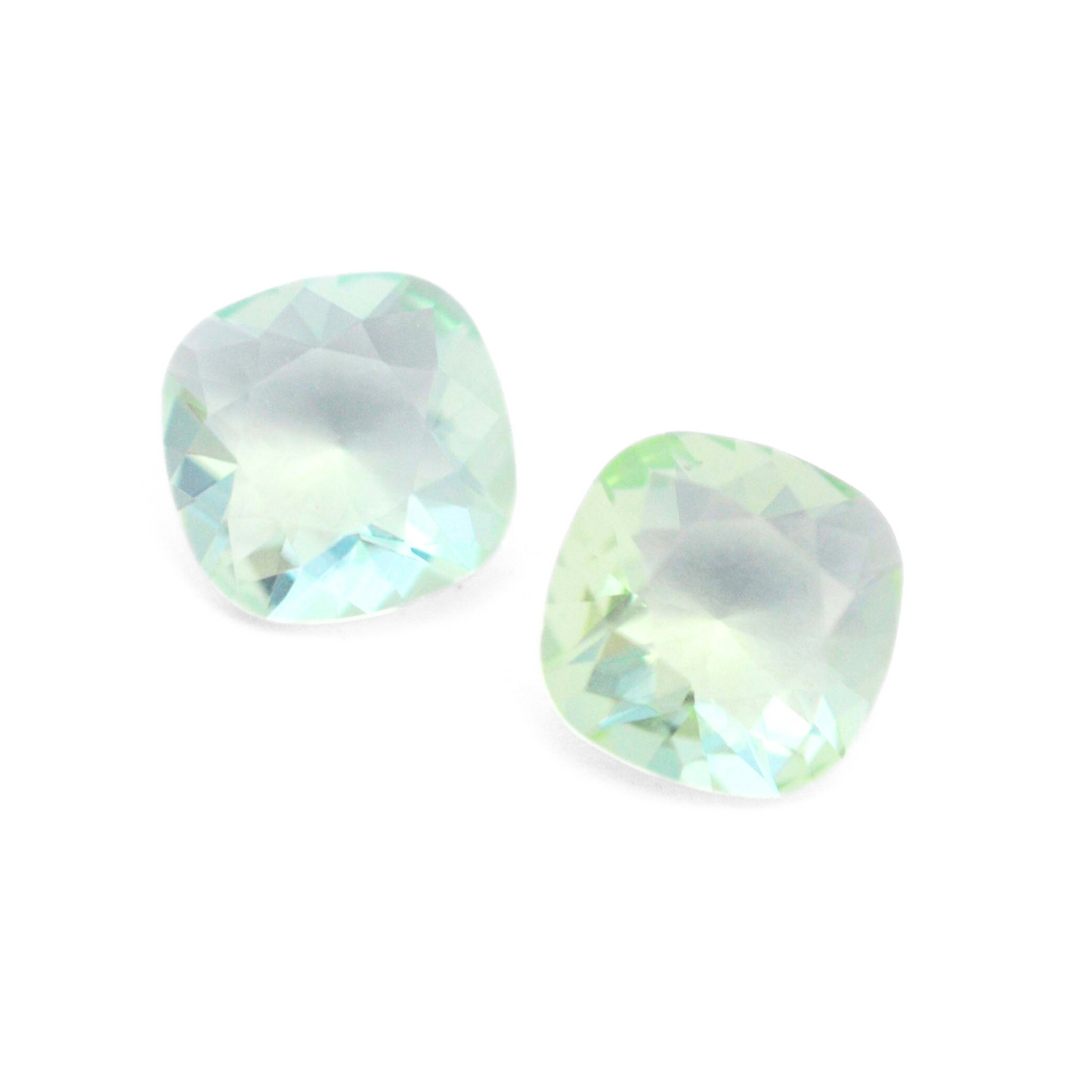 Cushion Square faceted Austrian crystal rhinestones in the color Chrysolite Unfoiled displayed on a white background.