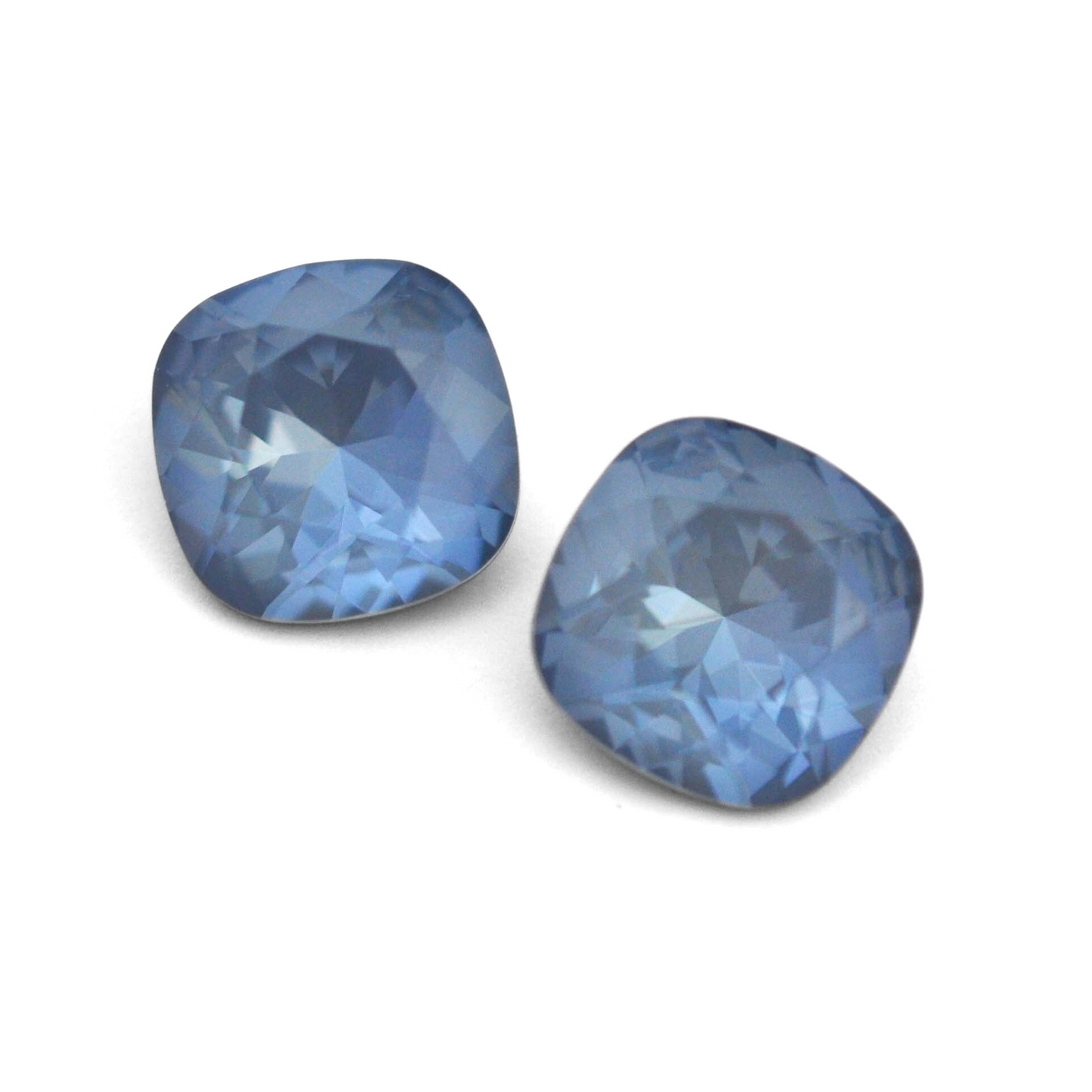 Cushion Square faceted Austrian crystal rhinestones in the color Denim Ignite displayed on a white background.