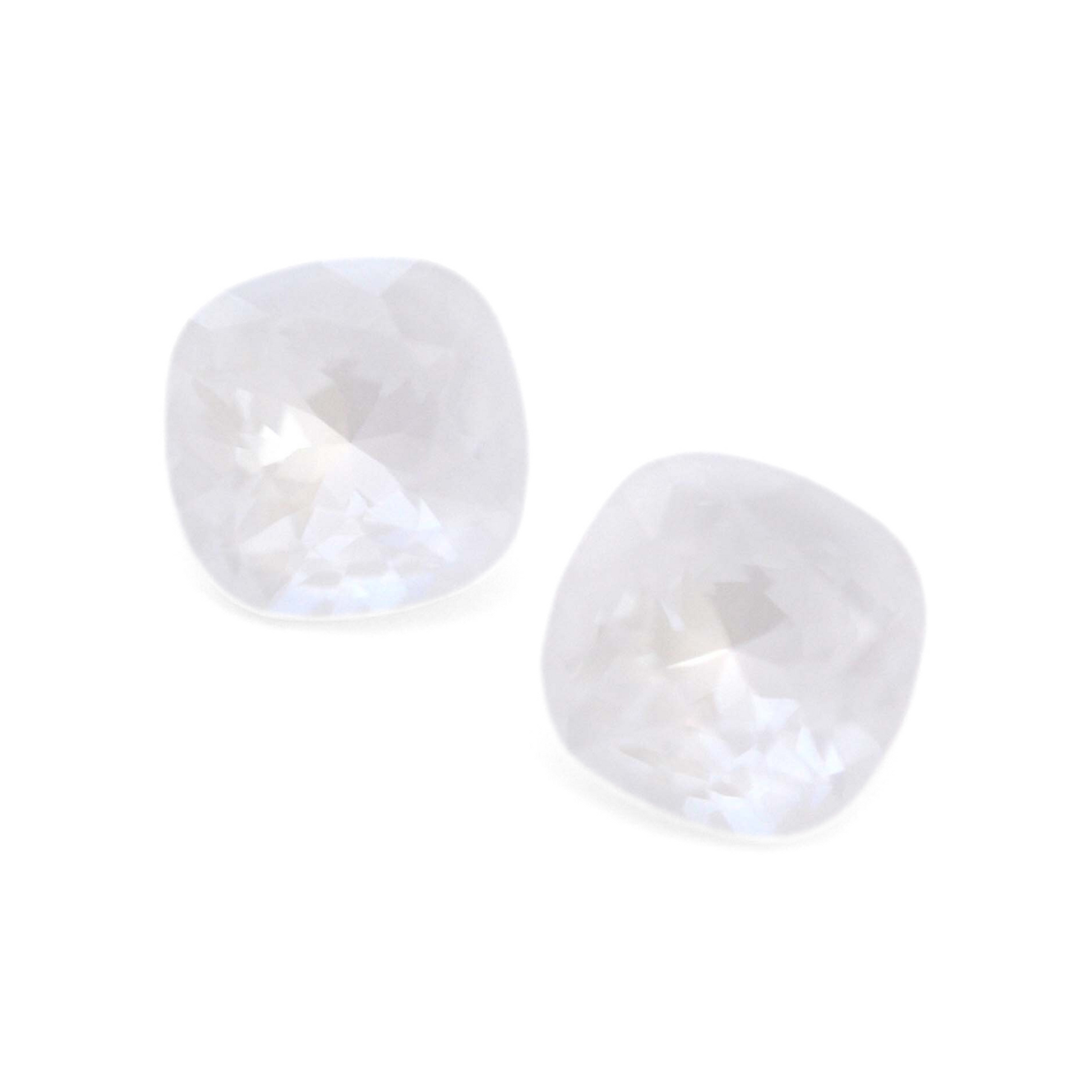 Cushion Square faceted Austrian crystal rhinestones in the color Electric White Ignite displayed on a white background.