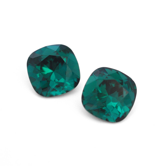Cushion Square faceted Austrian crystal rhinestones in the color Emerald displayed on a white background.