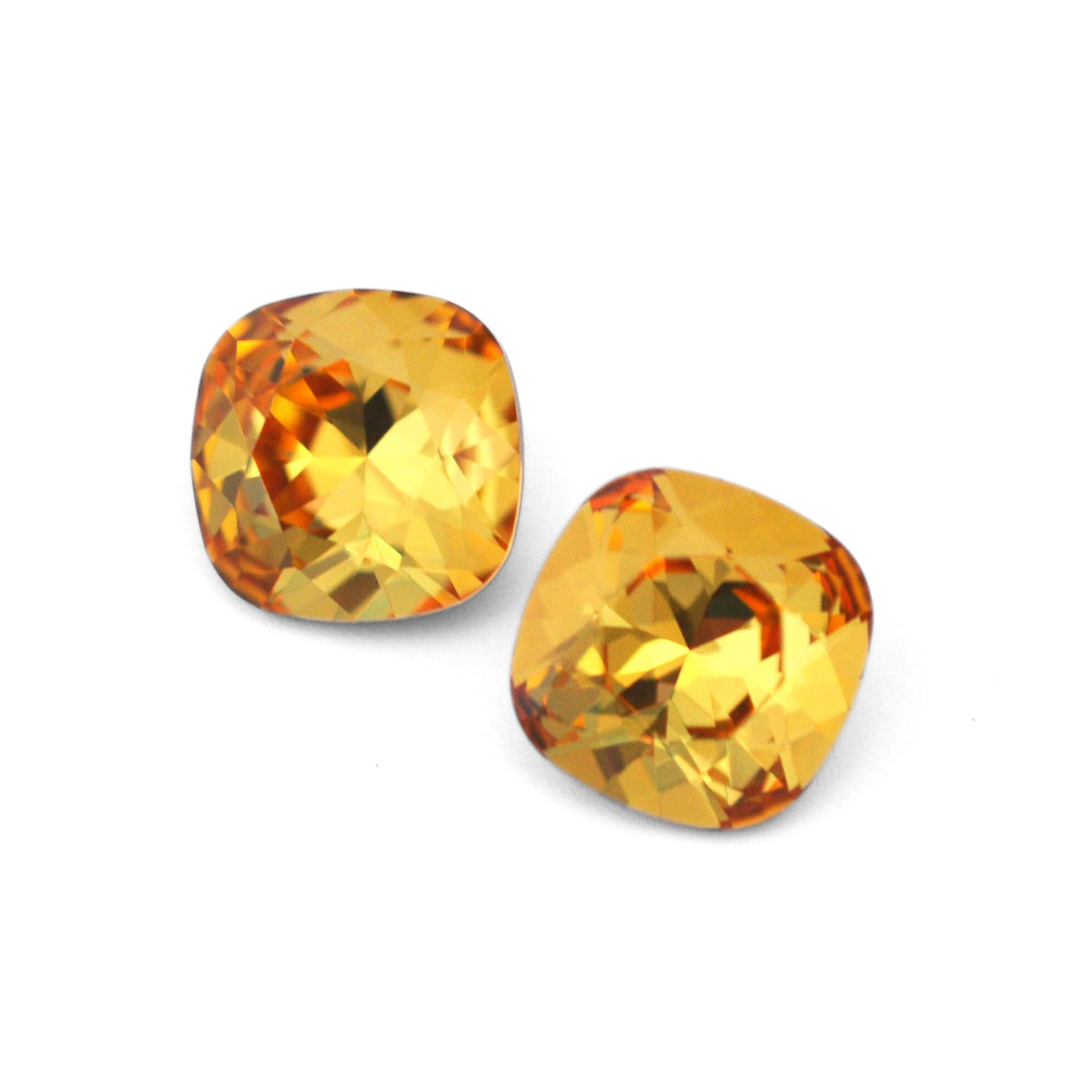Cushion Square faceted Austrian crystal rhinestones in the color Golden Topaz displayed on a white background.