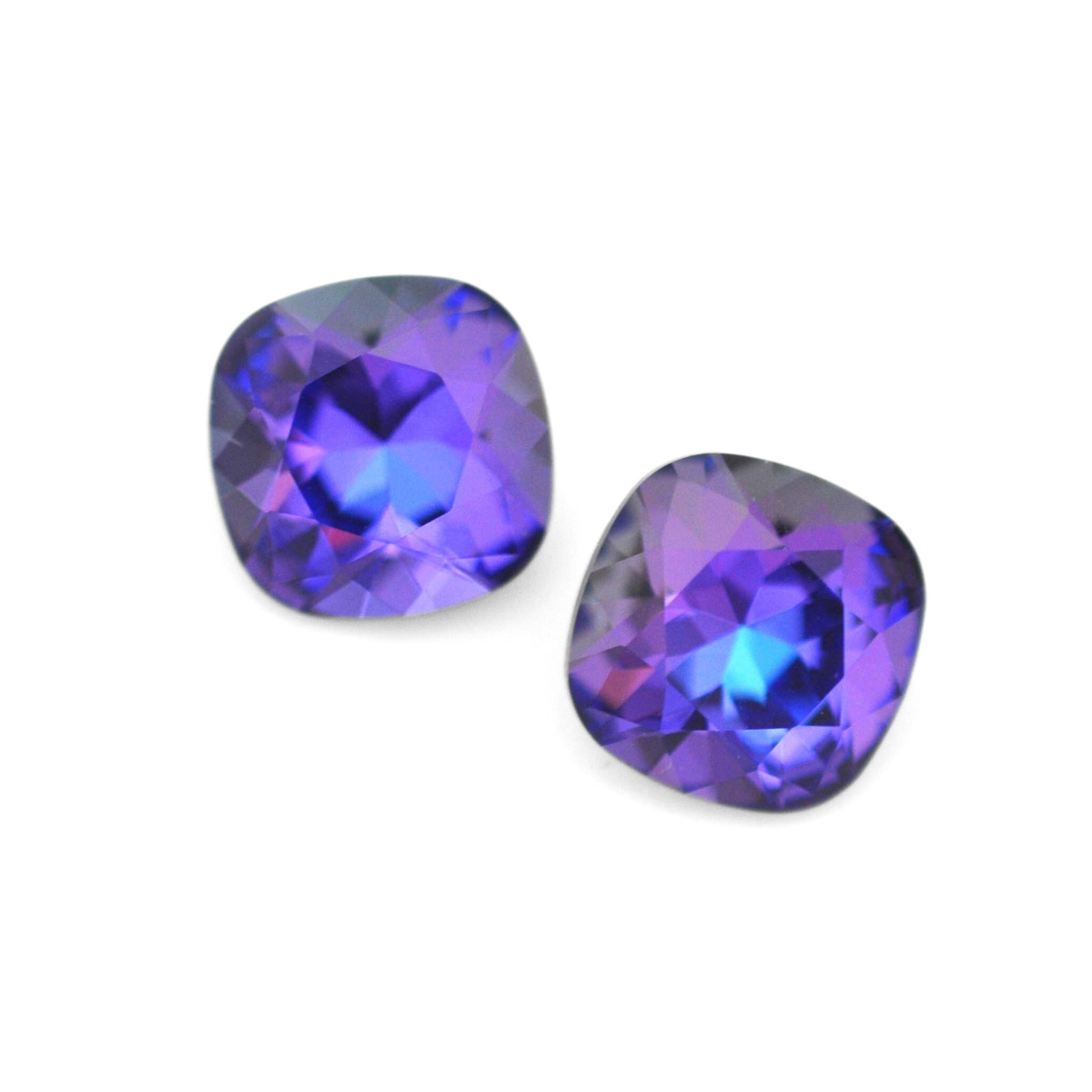 Cushion Square faceted Austrian crystal rhinestones in the color Heliotrope displayed on a white background.