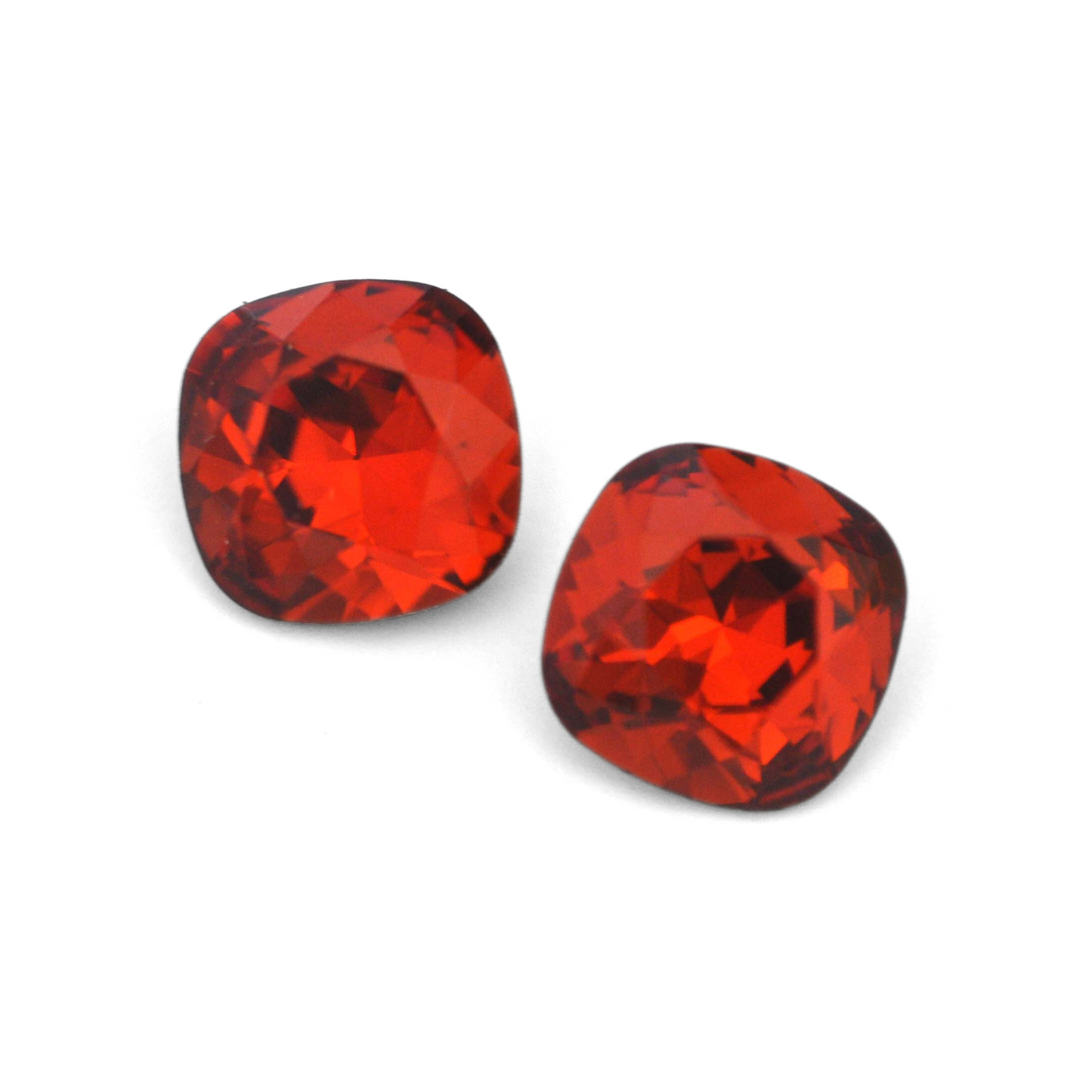 Cushion Square faceted Austrian crystal rhinestones in the color Indian Red displayed on a white background.