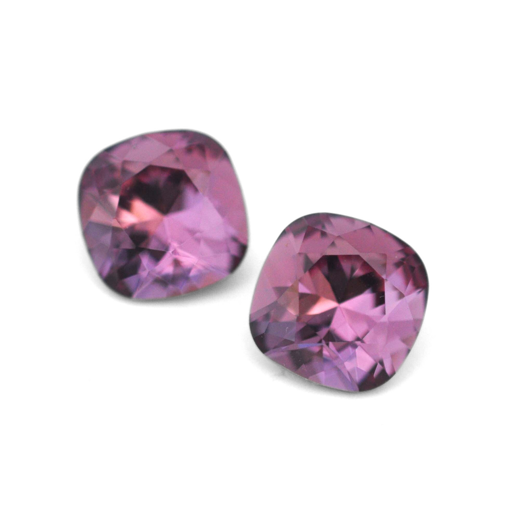 Cushion Square faceted Austrian crystal rhinestones in the color Iris displayed on a white background.