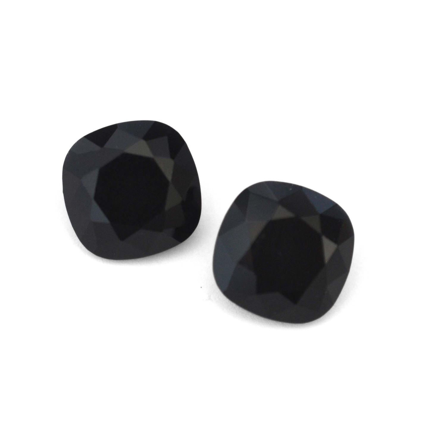 Cushion Square faceted Austrian crystal rhinestones in the color Jet displayed on a white background.