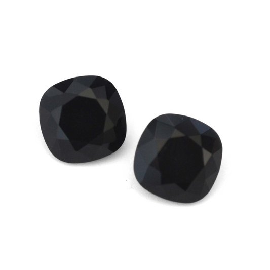 Cushion Square faceted Austrian crystal rhinestones in the color Jet displayed on a white background.