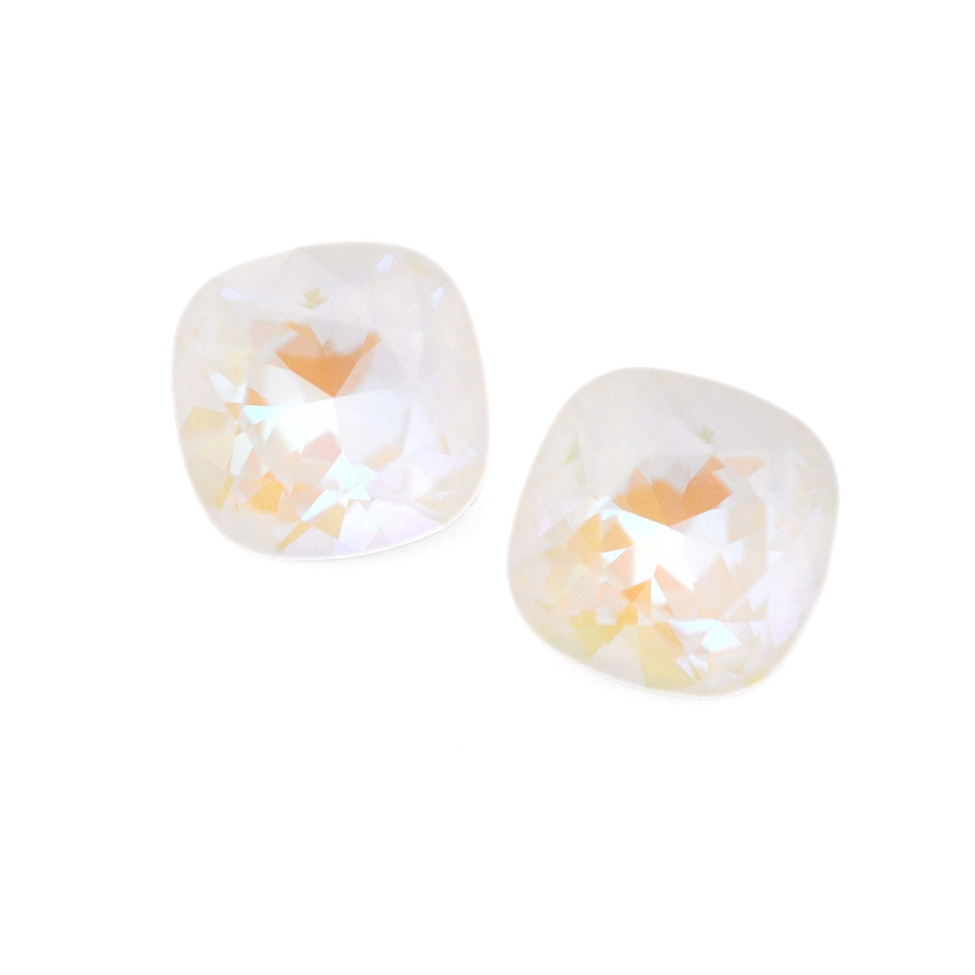 Cushion Square faceted Austrian crystal rhinestones in the color Light Grey Delite displayed on a white background.