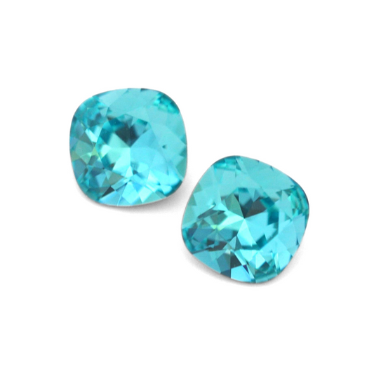 Cushion Square faceted Austrian crystal rhinestones in the color Light Turquoise displayed on a white background.